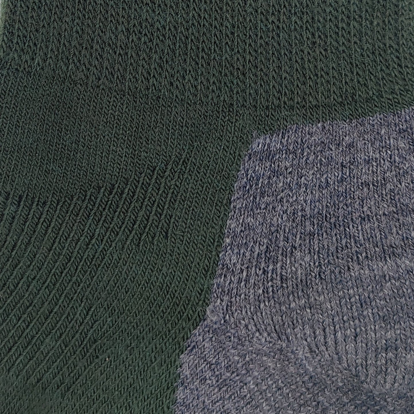 Close-up knit texture of Laetts green medium hiking crew socks made with Merino wool and patent-allowed HygroHeat™ thermal yarn.