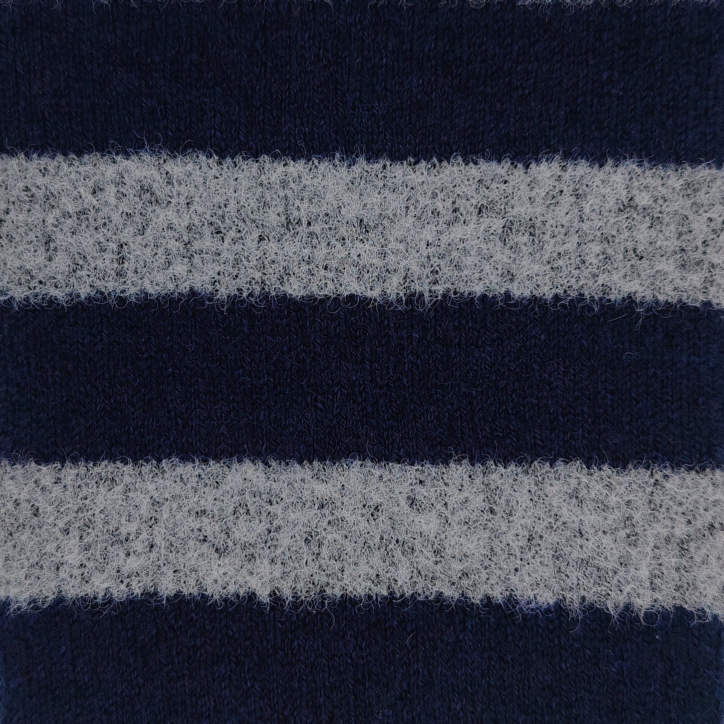 Close-up texture detail of Laetts Men’s Heavy+ Outdoor Socks showing cream and navy stripe knit, highlighting Merino wool fibers and patented HygroHeat™ thermal technology.