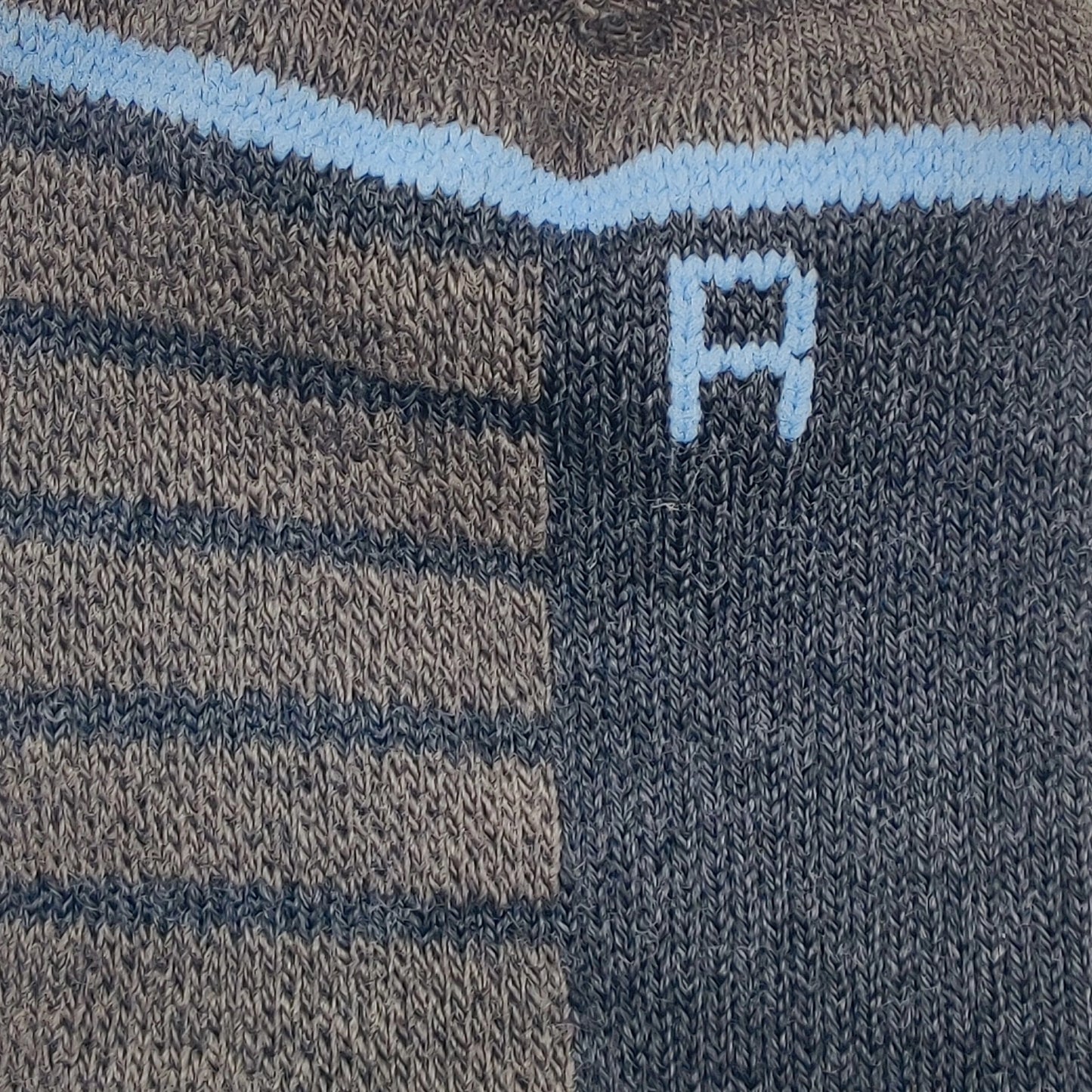 Close-up of Laetts Light Ski BootGlide Compression Sock, showing BootGlide knit zones and “R” right-foot indicator for precise boot fit.