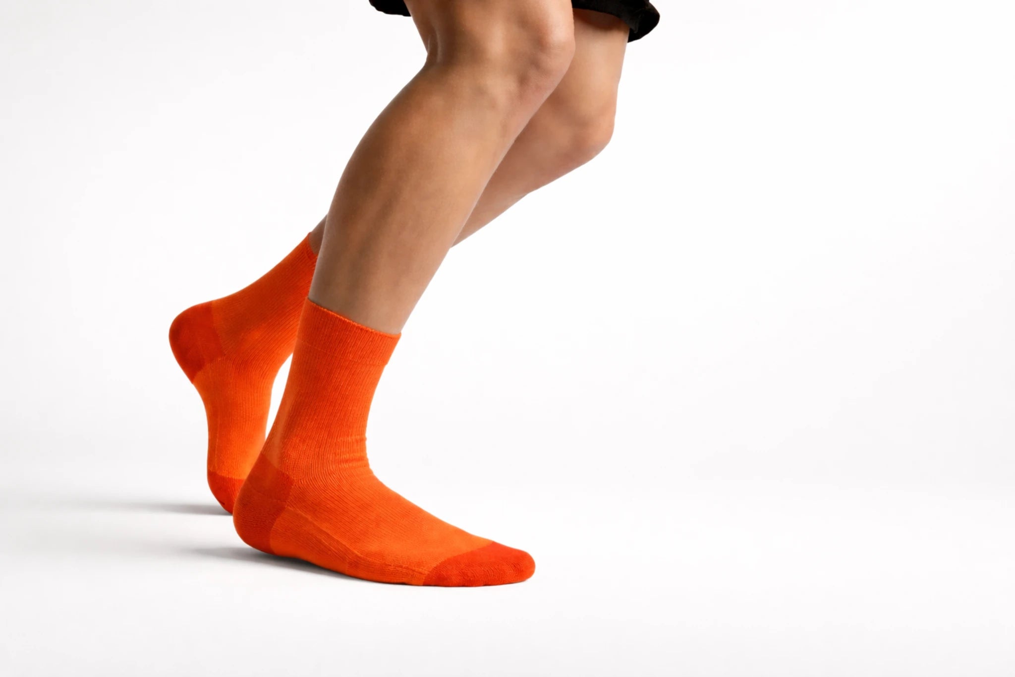 Laetts performance socks worn on feet, representing the Performance Fit Guide for cushioning, warmth, and activity-based sock selection.